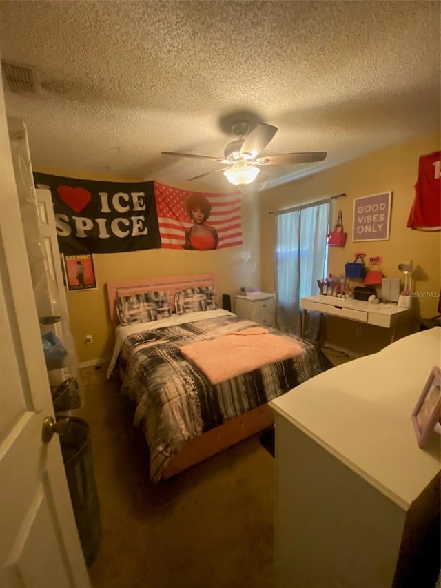 2122 Orange Tree Dr, Edgewater, FL 32141 - bedroom featuring a textured ceiling, carpet floors, and a ceiling fan