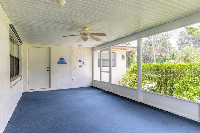 5060 Audubon Ave, De Leon Springs, FL 32130 - unfurnished sunroom featuring a ceiling fan and plenty of natural light