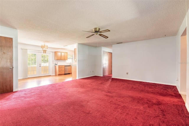 5060 Audubon Ave, De Leon Springs, FL 32130 - unfurnished living room featuring light carpet, ceiling fan, and a textured ceiling