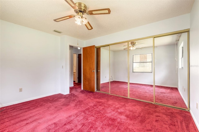 5060 Audubon Ave, De Leon Springs, FL 32130 - unfurnished bedroom featuring carpet floors, a textured ceiling, and a ceiling fan