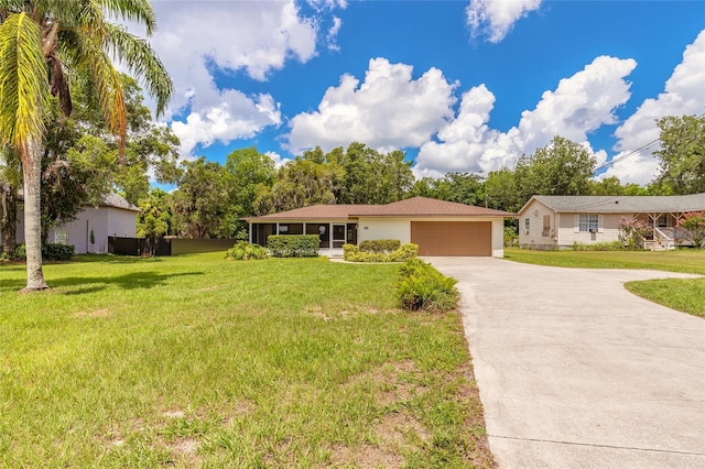 5060 Audubon Ave, De Leon Springs, FL 32130 - ranch-style house featuring driveway, an attached garage, a front yard, and stucco siding