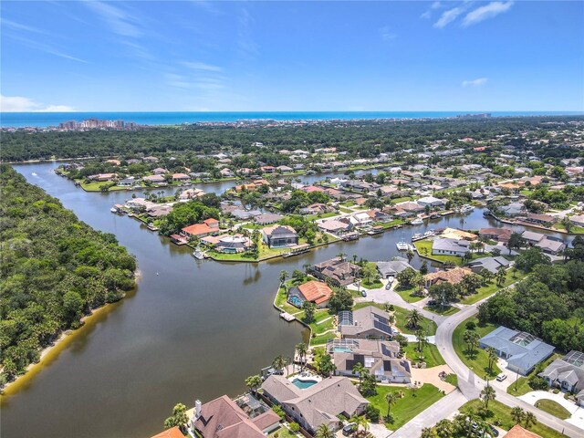 26 Creek Ct, Palm Coast, FL 32137 - aerial view of residential area with a large body of water