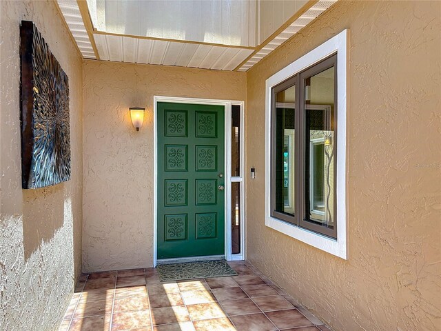 26 Creek Ct, Palm Coast, FL 32137 - doorway to property with stucco siding