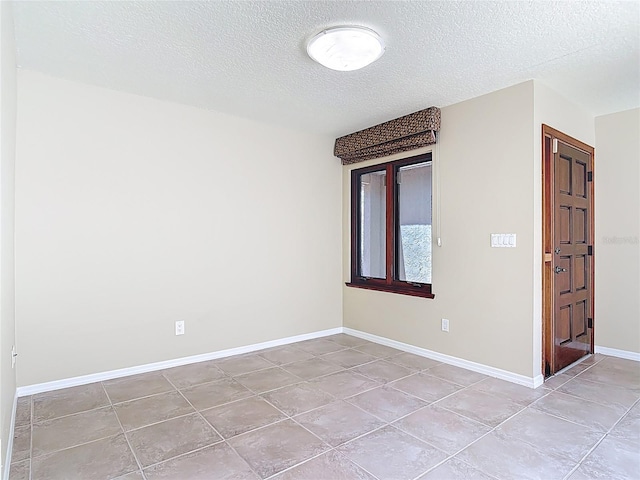 26 Creek Ct, Palm Coast, FL 32137 - spare room featuring light tile patterned floors and a textured ceiling