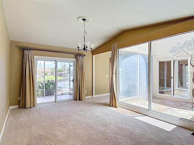 26 Creek Ct, Palm Coast, FL 32137 - empty room featuring lofted ceiling, carpet floors, and a chandelier