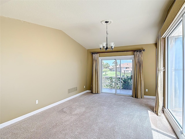26 Creek Ct, Palm Coast, FL 32137 - unfurnished dining area featuring a chandelier, carpet, and lofted ceiling