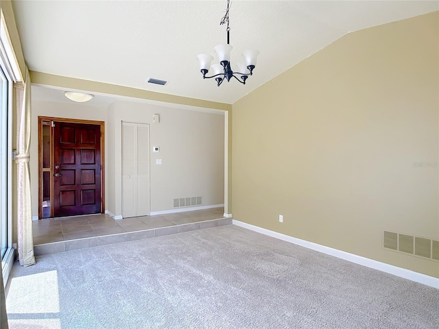 26 Creek Ct, Palm Coast, FL 32137 - empty room with vaulted ceiling, light carpet, and a chandelier
