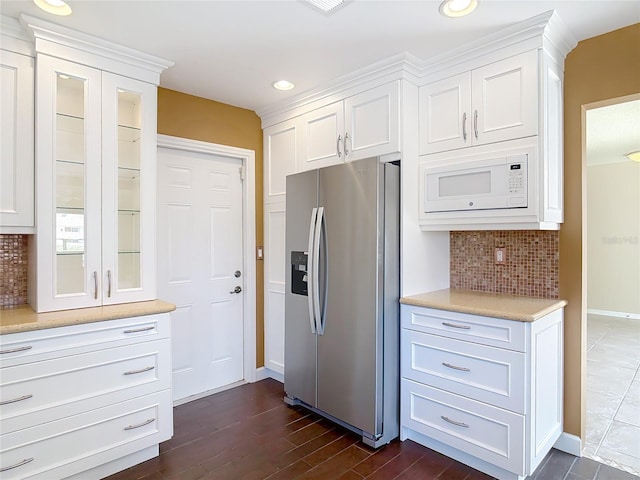 26 Creek Ct, Palm Coast, FL 32137 - kitchen featuring stainless steel fridge, white microwave, light countertops, white cabinetry, and recessed lighting