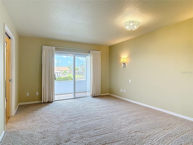26 Creek Ct, Palm Coast, FL 32137 - empty room with carpet and a textured ceiling