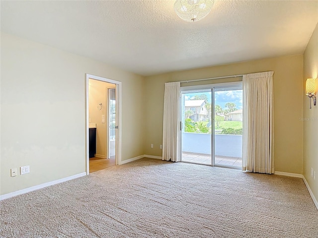 26 Creek Ct, Palm Coast, FL 32137 - empty room featuring light colored carpet and a textured ceiling