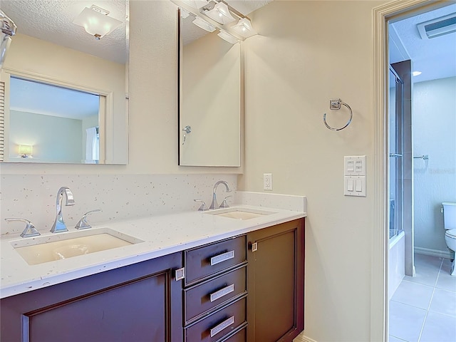 26 Creek Ct, Palm Coast, FL 32137 - full bathroom with double vanity, tile patterned flooring, and shower / washtub combination