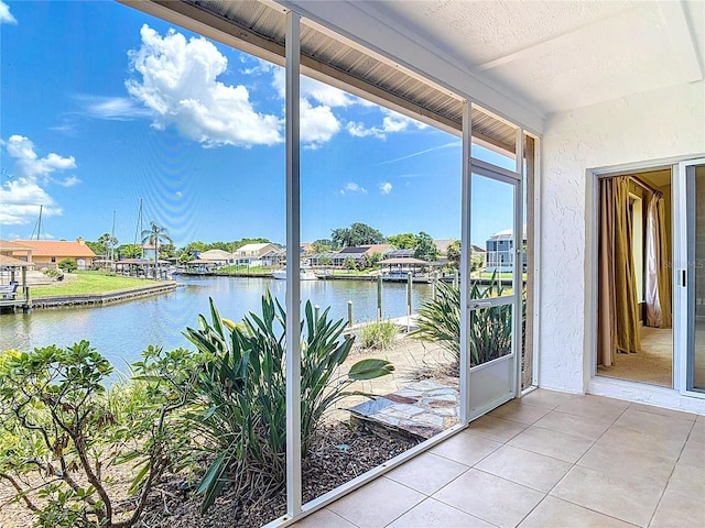 26 Creek Ct, Palm Coast, FL 32137 - unfurnished sunroom featuring a water view and a residential view