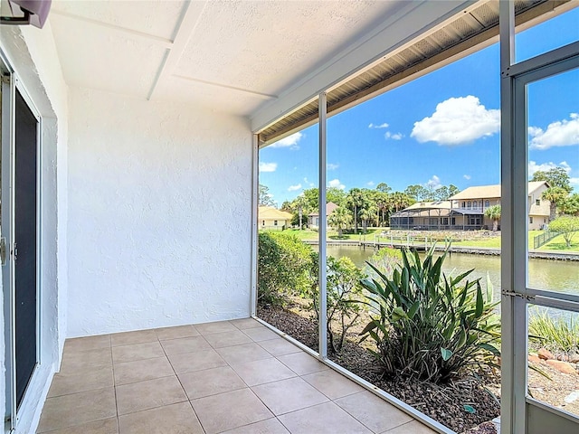 26 Creek Ct, Palm Coast, FL 32137 - unfurnished sunroom featuring a water view, plenty of natural light, and a residential view