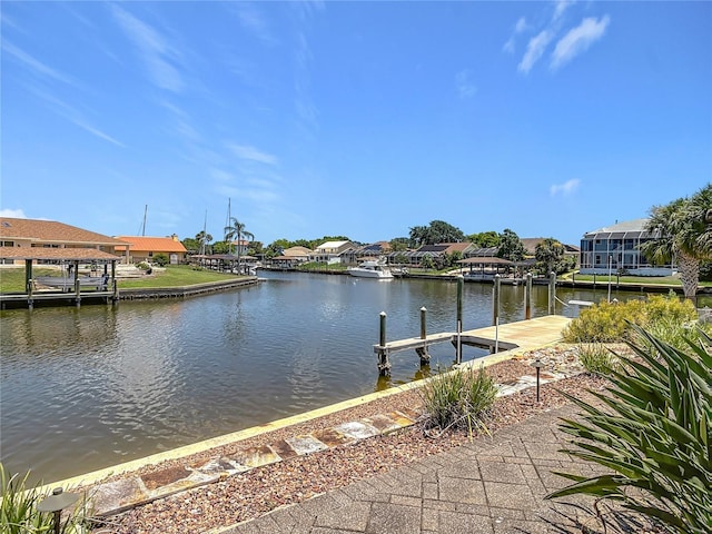 26 Creek Ct, Palm Coast, FL 32137 - dock with a water view and a residential view