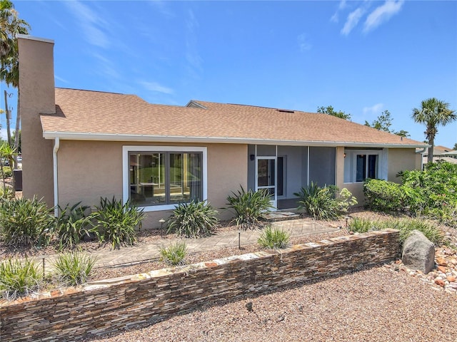 26 Creek Ct, Palm Coast, FL 32137 - ranch-style house with stucco siding, a chimney, and roof with shingles