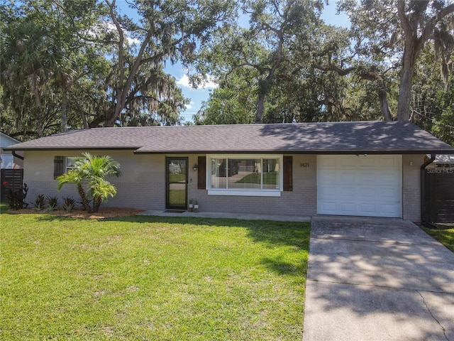 1421 Pine Tree Dr, Edgewater, FL 32132 - ranch-style house with brick siding, a garage, and a front lawn