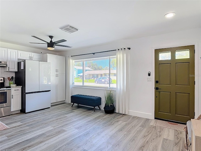 1421 Pine Tree Dr, Edgewater, FL 32132 - entryway featuring light wood-type flooring and a ceiling fan