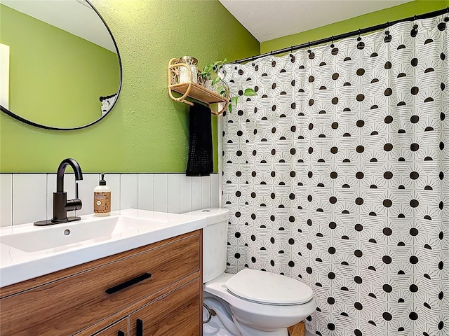 1421 Pine Tree Dr, Edgewater, FL 32132 - full bathroom with vanity, a textured wall, wainscoting, and curtained shower