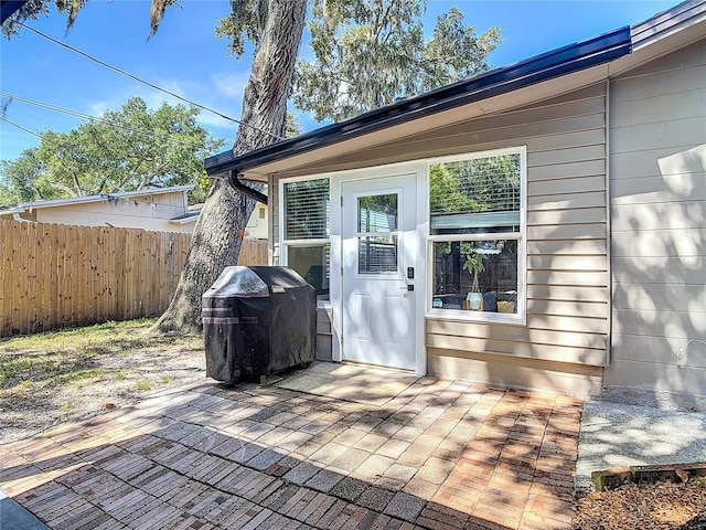 1421 Pine Tree Dr, Edgewater, FL 32132 - wooden deck featuring a grill and a patio