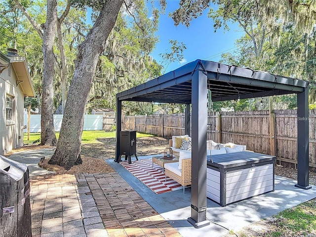 1421 Pine Tree Dr, Edgewater, FL 32132 - fenced backyard with a patio area, a gazebo, and an outdoor living space