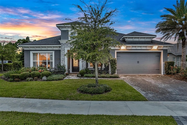 6294 W Fallsgrove Ln, Port Orange, FL 32128 - view of front of house featuring stucco siding, driveway, a yard, and an attached garage