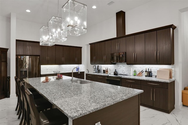 6294 W Fallsgrove Ln, Port Orange, FL 32128 - kitchen featuring appliances with stainless steel finishes, light marble finish flooring, tasteful backsplash, light stone counters, and dark brown cabinets