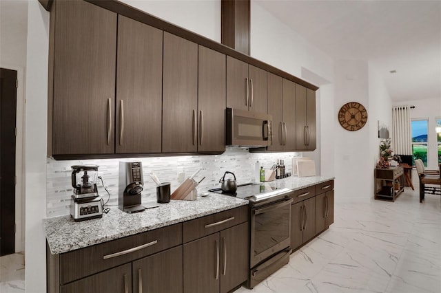 6294 W Fallsgrove Ln, Port Orange, FL 32128 - kitchen featuring black range with electric stovetop, light marble finish floors, decorative backsplash, and dark brown cabinets