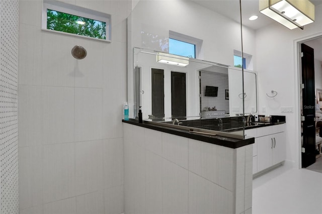6294 W Fallsgrove Ln, Port Orange, FL 32128 - bathroom with vanity, a walk in shower, and healthy amount of natural light