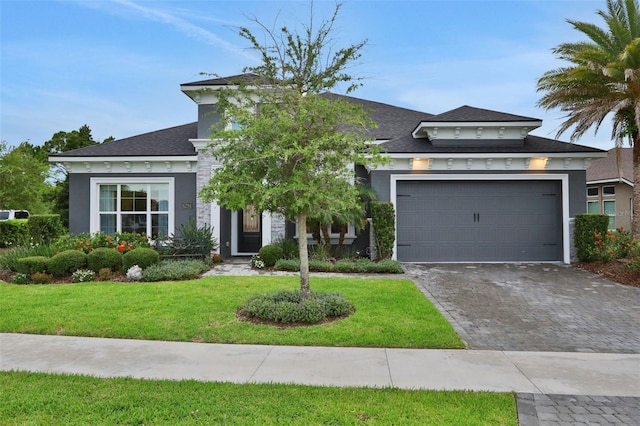 6294 W Fallsgrove Ln, Port Orange, FL 32128 - view of front facade with stucco siding, a front lawn, driveway, a garage, and a shingled roof