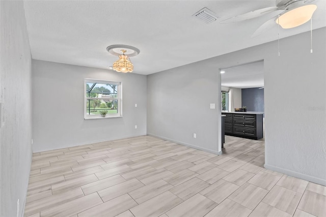 800 Black Duck Dr, Port Orange, FL 32127 - unfurnished room featuring wood tiled floors and a ceiling fan