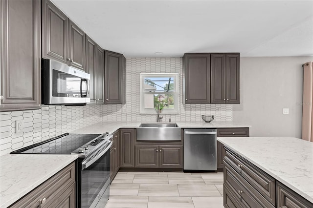 800 Black Duck Dr, Port Orange, FL 32127 - kitchen featuring stainless steel appliances, decorative backsplash, and light stone countertops