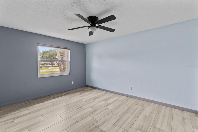 800 Black Duck Dr, Port Orange, FL 32127 - empty room with ceiling fan, a textured ceiling, and light wood-style floors