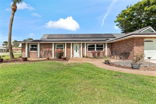 800 Black Duck Dr, Port Orange, FL 32127 - ranch-style house featuring brick siding, a front lawn, solar panels, and a garage