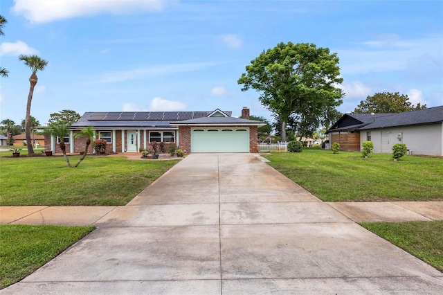 800 Black Duck Dr, Port Orange, FL 32127 - ranch-style home with an attached garage, a front yard, brick siding, and solar panels