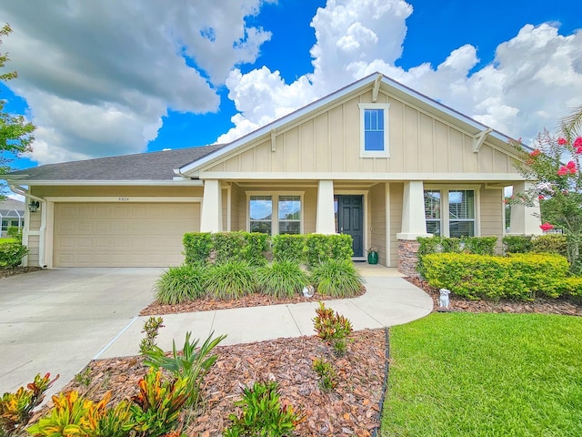 6804 Forkmead Ln, Port Orange, FL 32128 - craftsman-style house featuring board and batten siding, an attached garage, driveway, and a front lawn