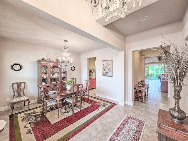 6804 Forkmead Ln, Port Orange, FL 32128 - dining room featuring a chandelier and baseboards