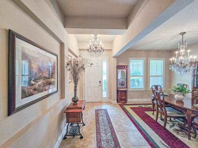 6804 Forkmead Ln, Port Orange, FL 32128 - entryway featuring a chandelier and light tile patterned floors