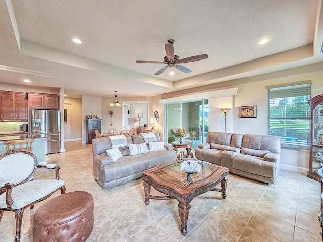 6804 Forkmead Ln, Port Orange, FL 32128 - living area with a tray ceiling, ceiling fan, recessed lighting, and light tile patterned floors