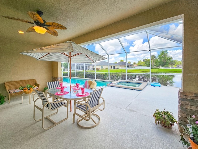 6804 Forkmead Ln, Port Orange, FL 32128 - view of patio with ceiling fan, a lanai, and a pool with connected hot tub