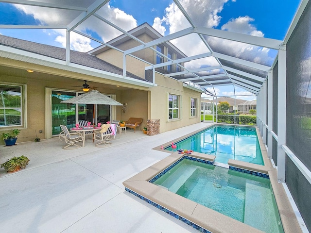 6804 Forkmead Ln, Port Orange, FL 32128 - view of swimming pool with a patio, ceiling fan, a pool with connected hot tub, and glass enclosure