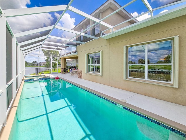 6804 Forkmead Ln, Port Orange, FL 32128 - view of pool with a patio, a pool with connected hot tub, and a lanai