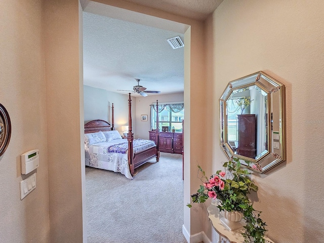 6804 Forkmead Ln, Port Orange, FL 32128 - bedroom featuring carpet, a textured ceiling, and a ceiling fan