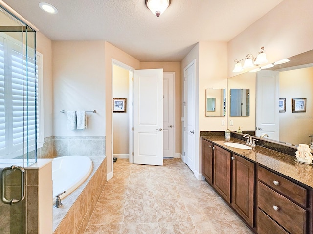 6804 Forkmead Ln, Port Orange, FL 32128 - full bath featuring vanity, a bath, a stall shower, and a textured ceiling