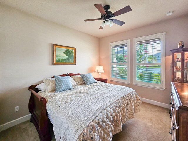 6804 Forkmead Ln, Port Orange, FL 32128 - bedroom featuring light colored carpet and ceiling fan