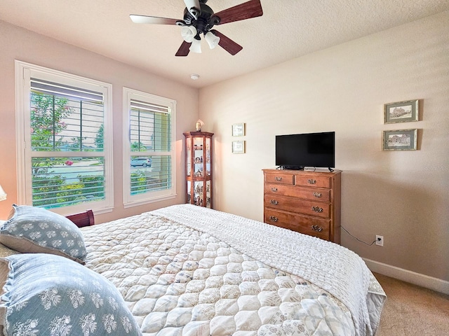 6804 Forkmead Ln, Port Orange, FL 32128 - carpeted bedroom with baseboards and a ceiling fan