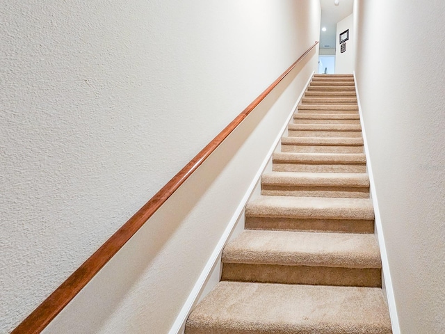 6804 Forkmead Ln, Port Orange, FL 32128 - staircase with a textured wall