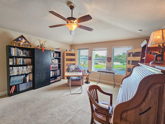 6804 Forkmead Ln, Port Orange, FL 32128 - sitting room with ceiling fan, carpet flooring, and a textured ceiling