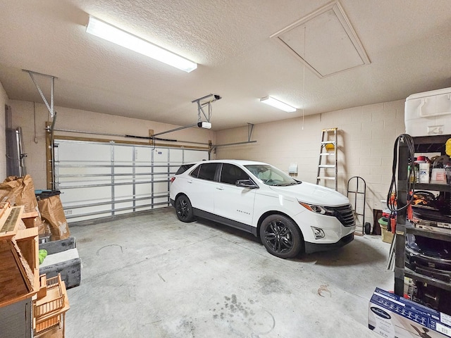 6804 Forkmead Ln, Port Orange, FL 32128 - garage featuring a garage door opener and concrete block wall