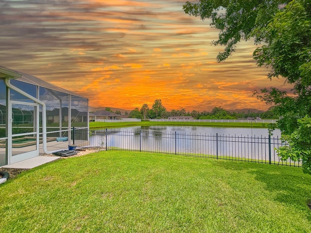6804 Forkmead Ln, Port Orange, FL 32128 - yard at dusk featuring a water view and glass enclosure
