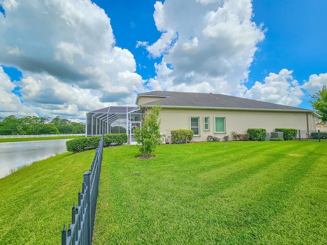 6804 Forkmead Ln, Port Orange, FL 32128 - rear view of house featuring stucco siding and a water view
